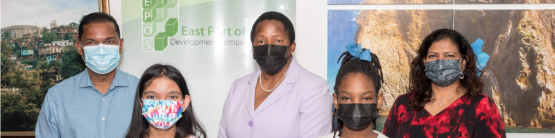 Dr. Deborah Thomas-Austin, MD of East Port of Spain Development Company Limited, Ms. Christyana Singh, (Donor),  Hon. Pennelope Beckles, Minister of Housing and Urban
Development, student of Excel Primary School (recipient) and Ms.
Anne Antoine, Principal of Excel Primary School, Beetham.